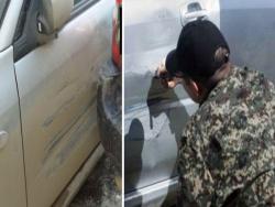 俄羅斯軍人不小心把「民車撞凹」…...結果他拿著一隻「麥克筆」，做了「這件事」......太狂啦！